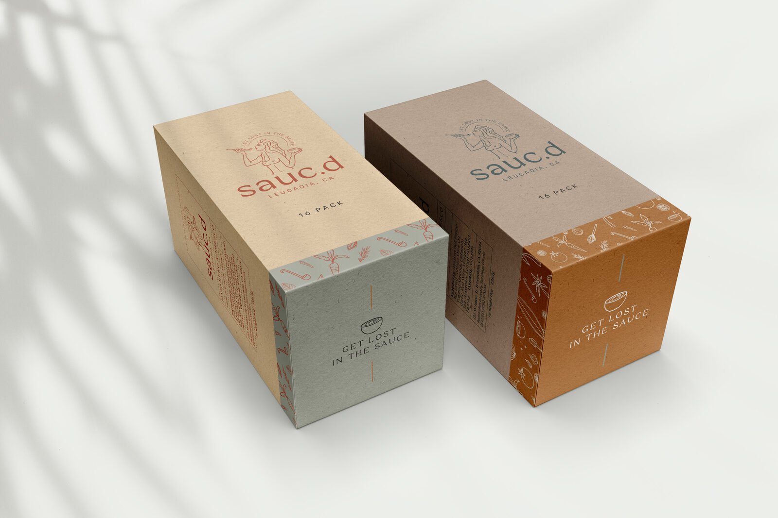 Sauc.d sixteen-pack cartons showing the illustrated label system and Get Lost In The Sauce panel